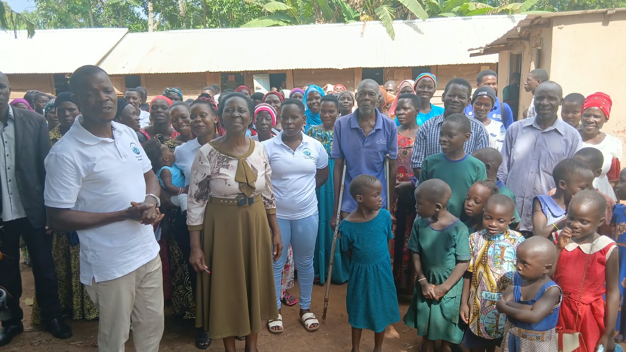 Give A Smile Ministries team with community members in Uganda